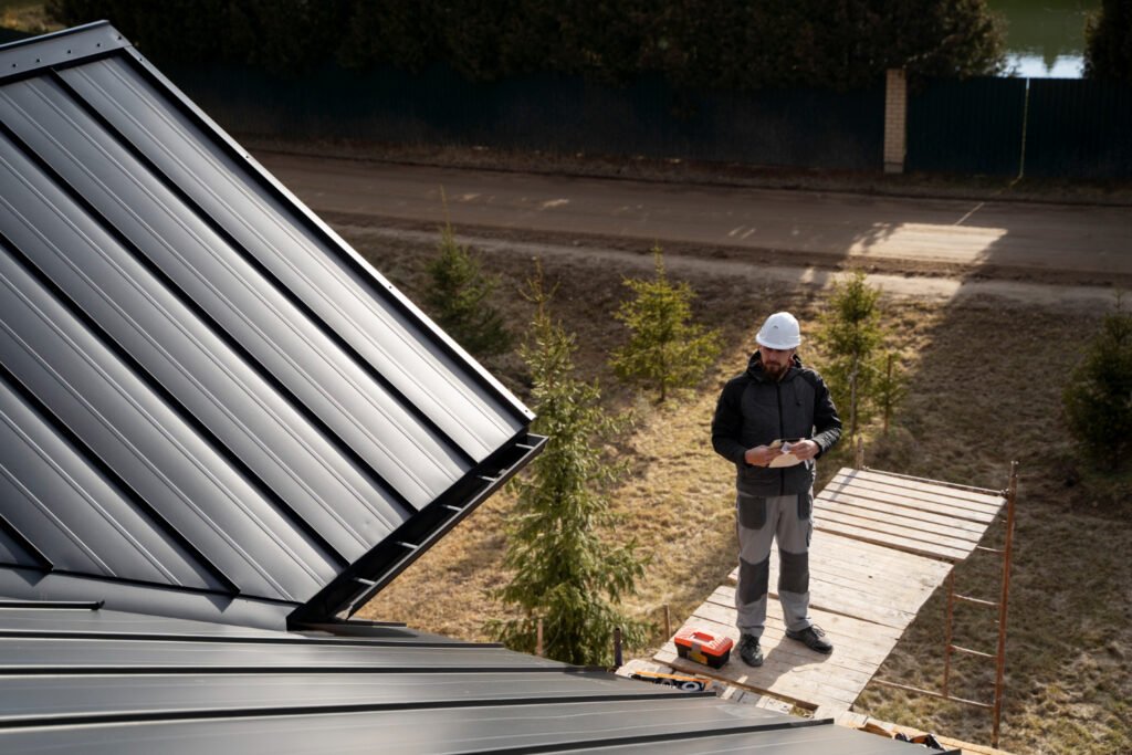 Roofer inspecting a roof in Concord, MA